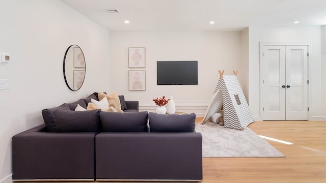 living room with hardwood / wood-style floors