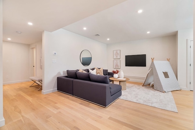 living room with light hardwood / wood-style floors