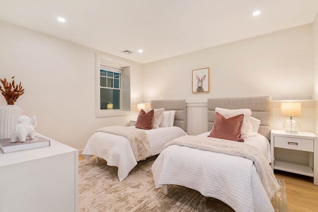 bedroom with light hardwood / wood-style floors