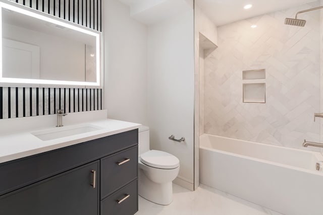 full bathroom with vanity, tiled shower / bath combo, toilet, and tile patterned floors