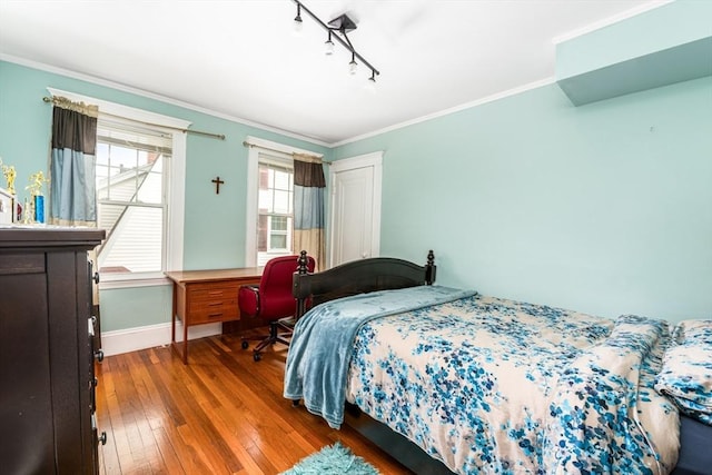 159 White St Unit 159, Belmont, MA 02478 - bedroom with wood-type flooring, track lighting, baseboards, and ornamental molding