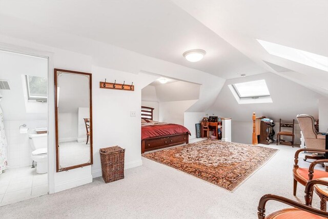 159 White St Unit 159, Belmont, MA 02478 - bedroom with a skylight, carpet floors, vaulted ceiling, and connected bathroom