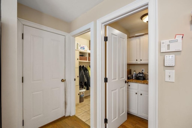 hallway with light wood-type flooring