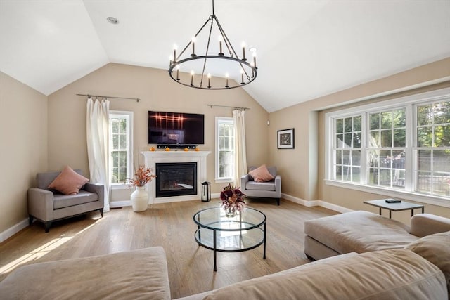 living room featuring plenty of natural light and light hardwood / wood-style floors