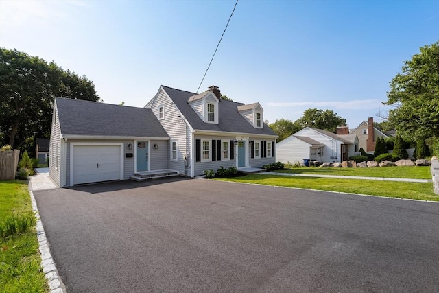 173 Liberty St, Braintree, MA 02184 - cape cod home featuring a garage, a front lawn, driveway, and a chimney