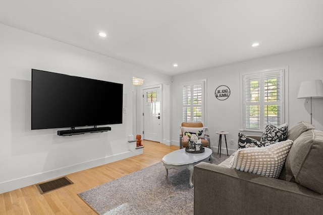 173 Liberty St, Braintree, MA 02184 - living area with light wood-style floors, healthy amount of natural light, and recessed lighting