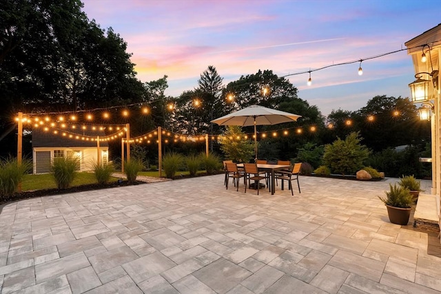 173 Liberty St, Braintree, MA 02184 - patio terrace at dusk featuring a patio and outdoor dining space