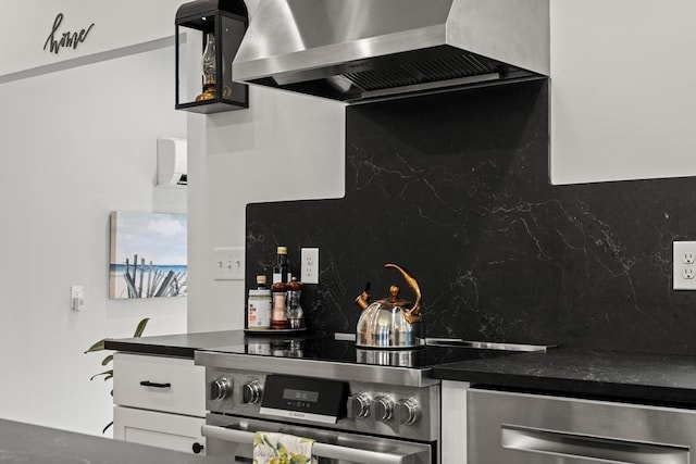 173 Liberty St, Braintree, MA 02184 - kitchen featuring wall chimney exhaust hood, stainless steel appliances, dark countertops, and decorative backsplash
