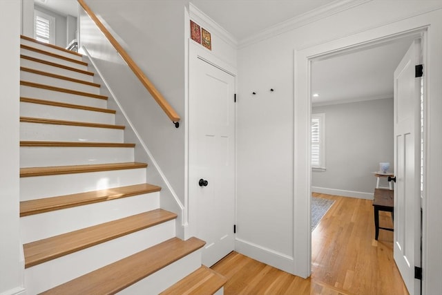 173 Liberty St, Braintree, MA 02184 - stairs featuring crown molding, wood finished floors, and recessed lighting