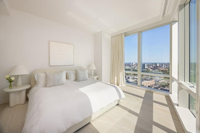 bedroom with a view of city