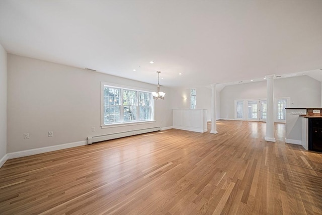 307 York St, Canton, MA 02021 - unfurnished living room with baseboards, baseboard heating, ornate columns, light wood-type flooring, and a notable chandelier