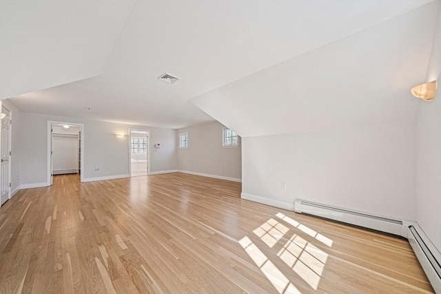 307 York St, Canton, MA 02021 - additional living space featuring baseboards, visible vents, baseboard heating, and light wood-type flooring
