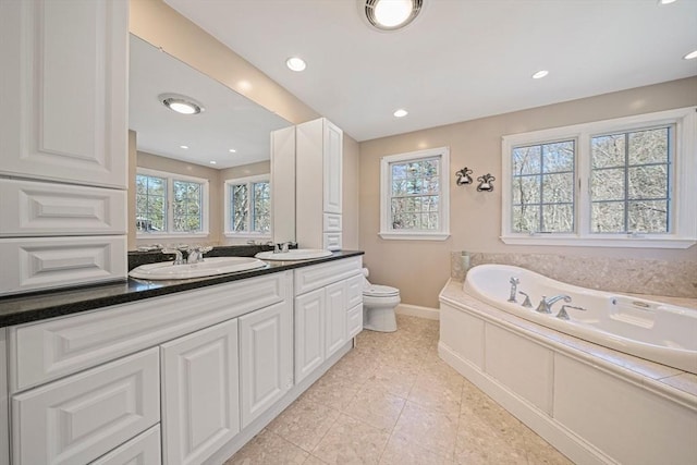 307 York St, Canton, MA 02021 - bathroom with toilet, plenty of natural light, and a sink