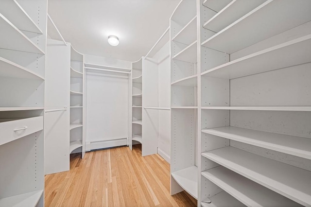 307 York St, Canton, MA 02021 - spacious closet with a baseboard heating unit and wood finished floors