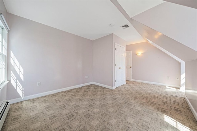 307 York St, Canton, MA 02021 - additional living space featuring visible vents, lofted ceiling, baseboards, baseboard heating, and light colored carpet