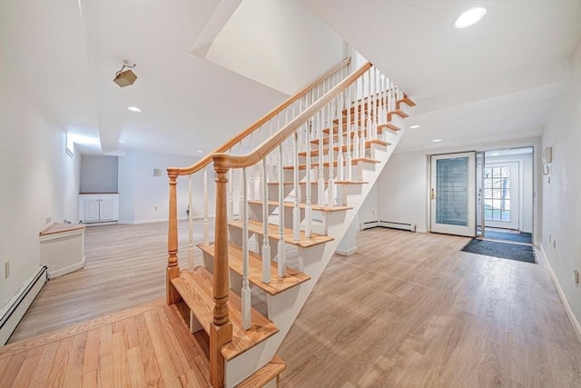 307 York St, Canton, MA 02021 - stairway featuring recessed lighting, baseboards, wood finished floors, a baseboard radiator, and a baseboard heating unit