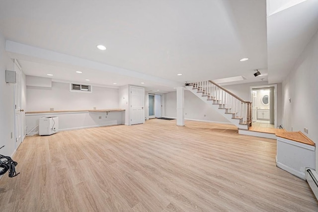 307 York St, Canton, MA 02021 - unfurnished living room with light wood-style floors, recessed lighting, baseboards, and stairway