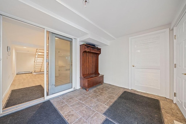 307 York St, Canton, MA 02021 - entryway featuring a baseboard heating unit and stone finish floor