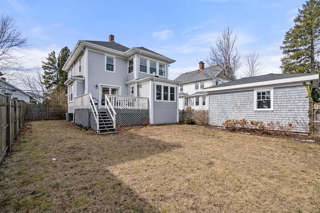 back of property featuring central AC unit, a wooden deck, a fenced backyard, a chimney, and stairs