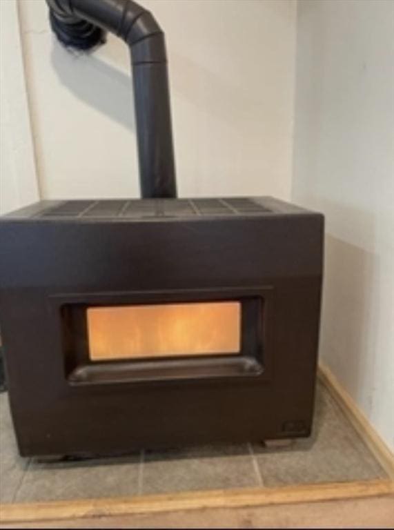 interior details featuring a wood stove