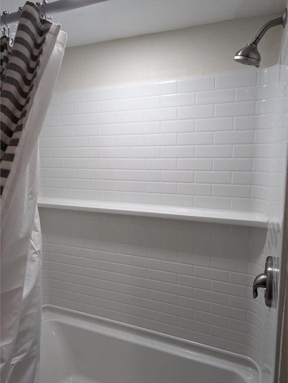 details with shower / bath combination with curtain