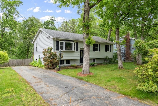 13 Karen Cir, Holliston, MA 01746 - split foyer home featuring roof with shingles and asphalt driveway