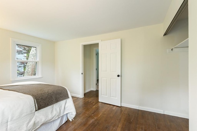 13 Karen Cir, Holliston, MA 01746 - bedroom with dark wood-style flooring and baseboards