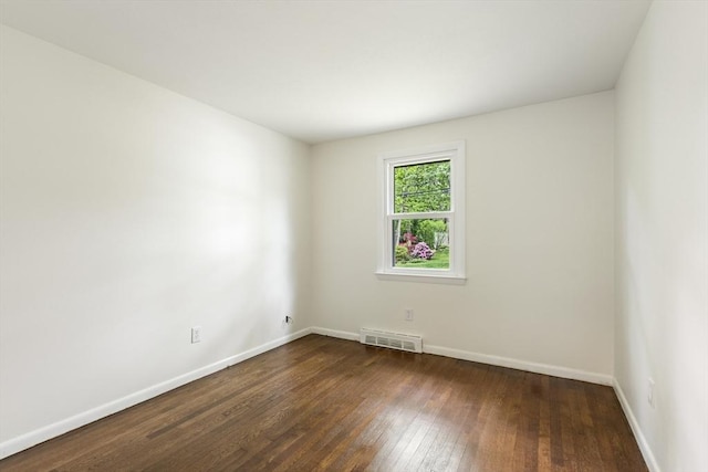 13 Karen Cir, Holliston, MA 01746 - empty room with dark wood finished floors and baseboards
