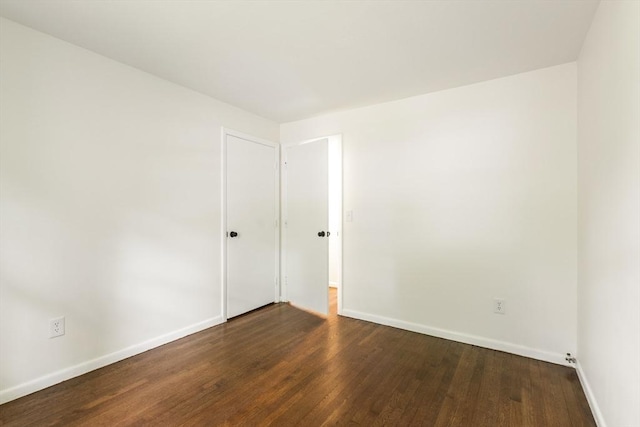 13 Karen Cir, Holliston, MA 01746 - empty room with baseboards and dark wood-style flooring