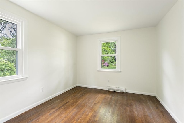 13 Karen Cir, Holliston, MA 01746 - empty room featuring plenty of natural light, hardwood / wood-style floors, and baseboards