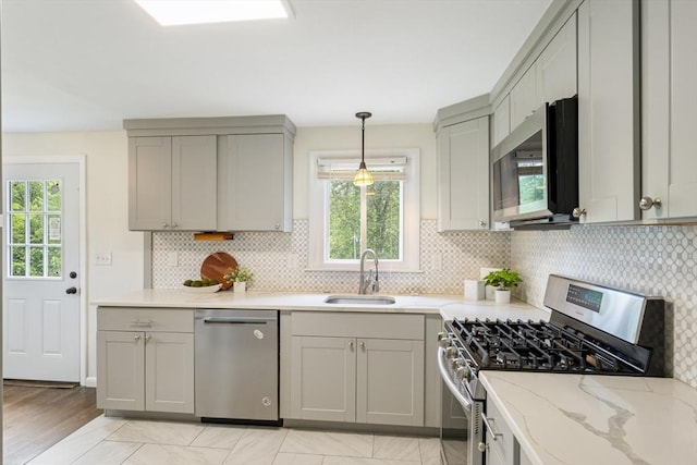 13 Karen Cir, Holliston, MA 01746 - kitchen with stainless steel appliances, a sink, gray cabinets, and healthy amount of natural light