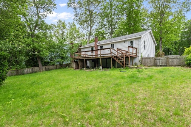 13 Karen Cir, Holliston, MA 01746 - back of property with a deck, stairway, and a chimney