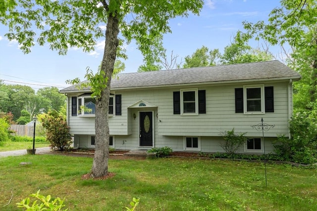 13 Karen Cir, Holliston, MA 01746 - bi-level home with a front lawn and roof with shingles