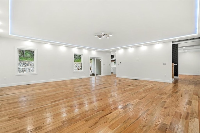 12 Martin St, Carlisle, MA 01741 - unfurnished living room featuring light wood-style flooring and recessed lighting