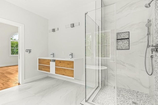 12 Martin St, Carlisle, MA 01741 - bathroom with a marble finish shower, marble finish floors, and double vanity
