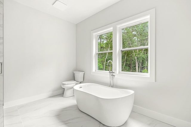 12 Martin St, Carlisle, MA 01741 - bathroom featuring a soaking tub and marble finish flooring
