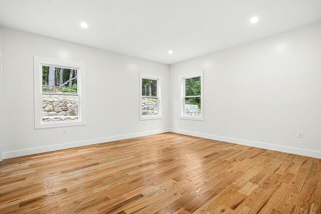 12 Martin St, Carlisle, MA 01741 - empty room featuring healthy amount of natural light, light wood-style floors, and recessed lighting