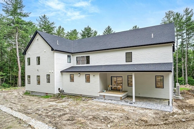 12 Martin St, Carlisle, MA 01741 - back of house with roof with shingles and a patio area