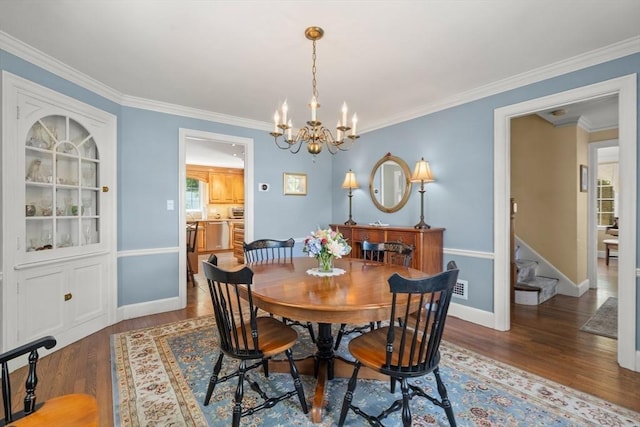 16 Bailey Ln, Dedham, MA 02026 - dining room with wood finished floors, a chandelier, stairway, crown molding, and baseboards