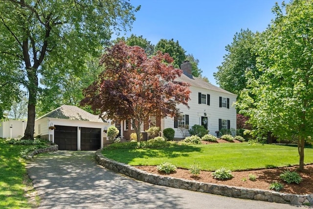16 Bailey Ln, Dedham, MA 02026 - colonial inspired home featuring a front lawn and a chimney