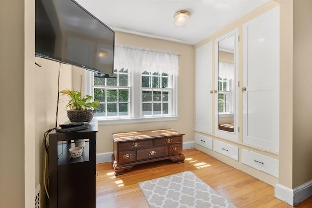 16 Bailey Ln, Dedham, MA 02026 - sitting room with light wood finished floors and baseboards