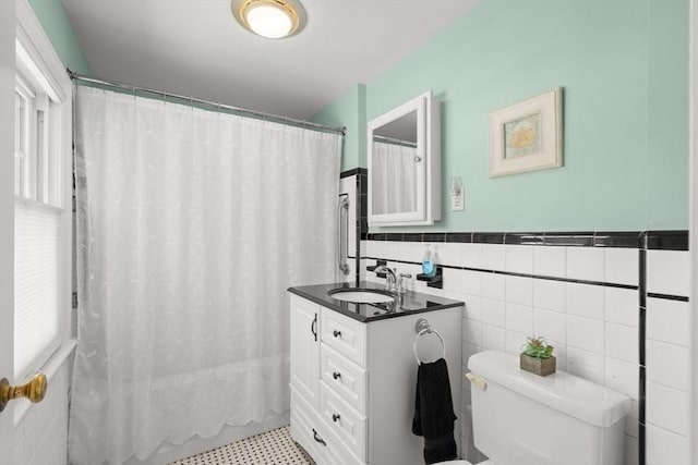 16 Bailey Ln, Dedham, MA 02026 - full bath with toilet, vanity, tile walls, shower / bath combo, and wainscoting