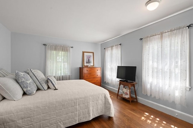 16 Bailey Ln, Dedham, MA 02026 - bedroom featuring multiple windows, baseboards, and wood finished floors