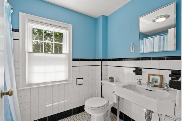 16 Bailey Ln, Dedham, MA 02026 - bathroom featuring tile walls, toilet, wainscoting, and a sink