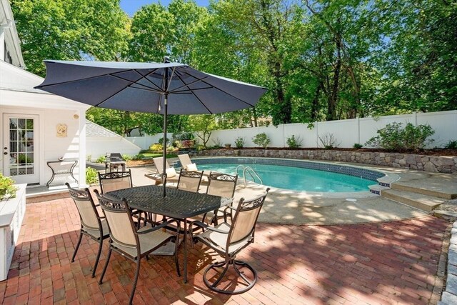 16 Bailey Ln, Dedham, MA 02026 - view of pool with a fenced backyard, a patio area, and outdoor dining space