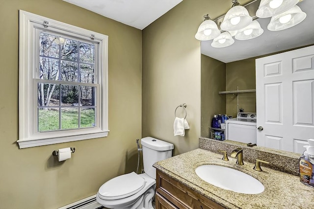 56 Ireta Rd, Shrewsbury, MA 01545 - bathroom featuring plenty of natural light, toilet, washer / clothes dryer, and a baseboard heating unit