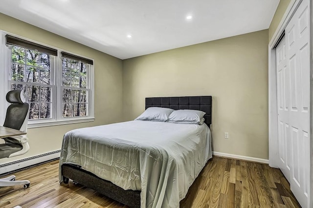 56 Ireta Rd, Shrewsbury, MA 01545 - bedroom with recessed lighting, a closet, wood finished floors, baseboards, and a baseboard heating unit
