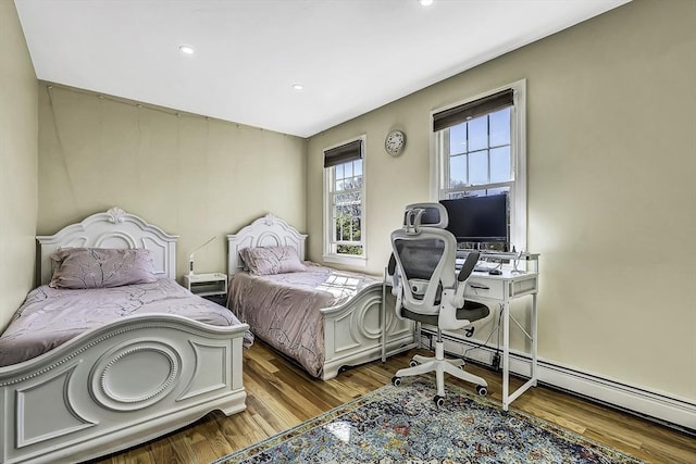 56 Ireta Rd, Shrewsbury, MA 01545 - bedroom with wood finished floors, baseboard heating, recessed lighting, and an office area