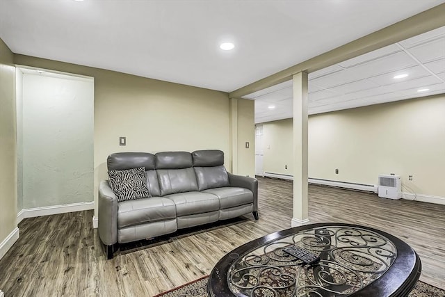 56 Ireta Rd, Shrewsbury, MA 01545 - living room featuring baseboard heating, wood finished floors, baseboards, and recessed lighting