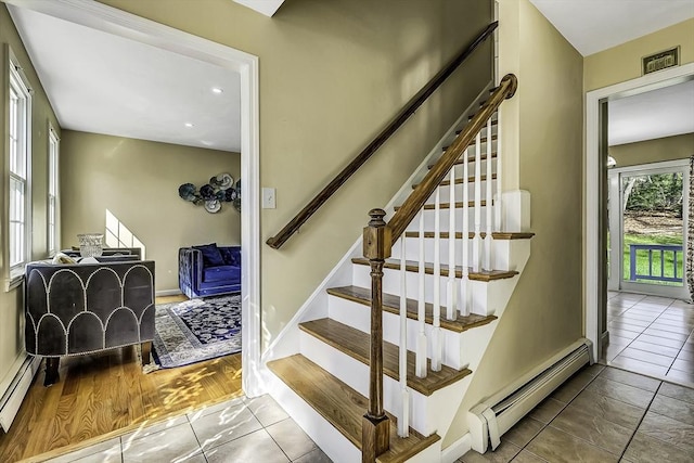 56 Ireta Rd, Shrewsbury, MA 01545 - stairs featuring baseboard heating, tile patterned floors, baseboards, and recessed lighting